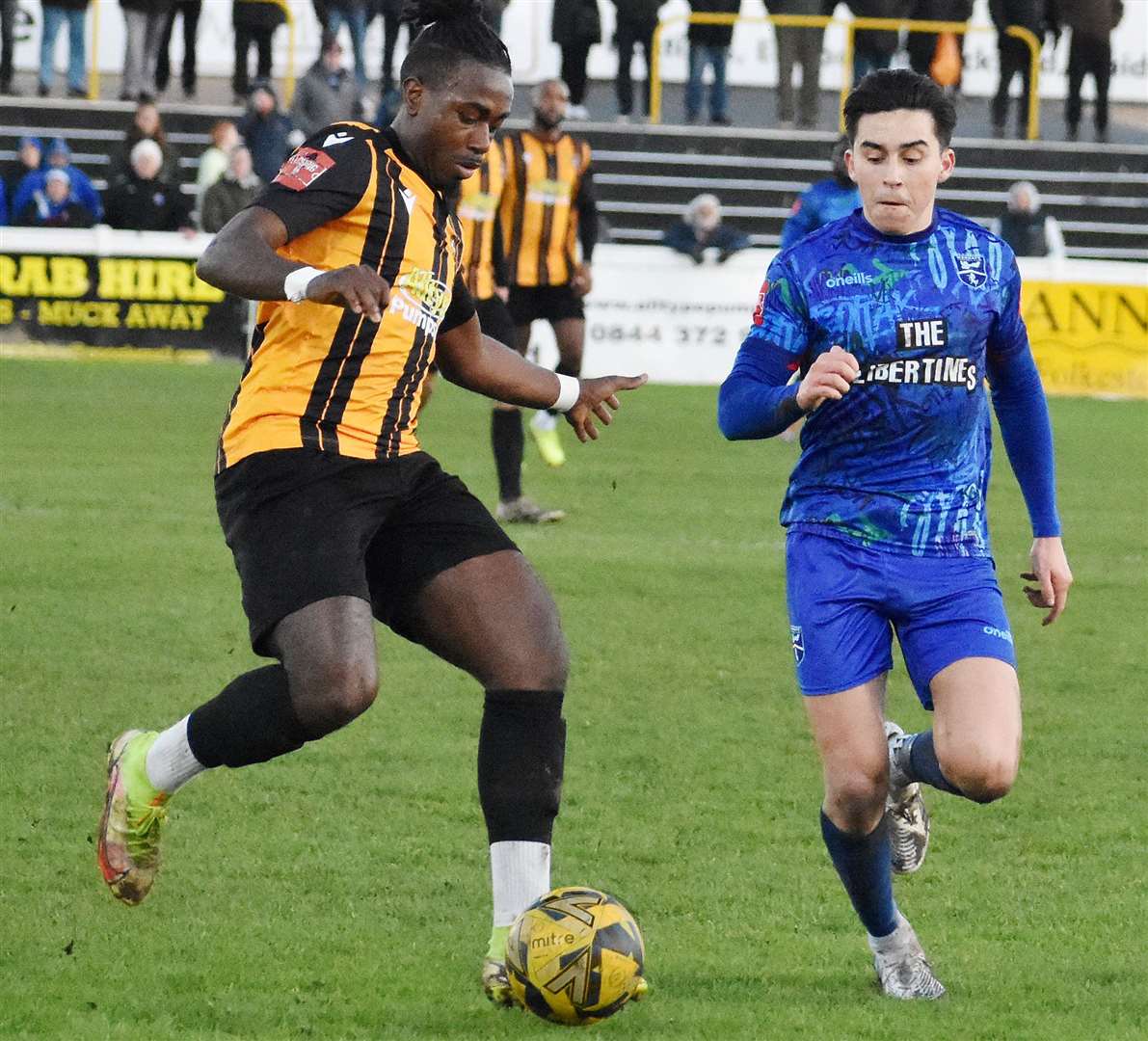 Folkestone man Ira Jackson up against returning Margate defender Harrison Hatfull in Invicta's 4-0 home derby win. Picture: Randolph File