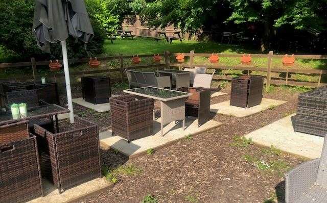 They might not have got round to filling the planters this year but there is plenty of outdoor garden furniture positioned on solid concrete bases