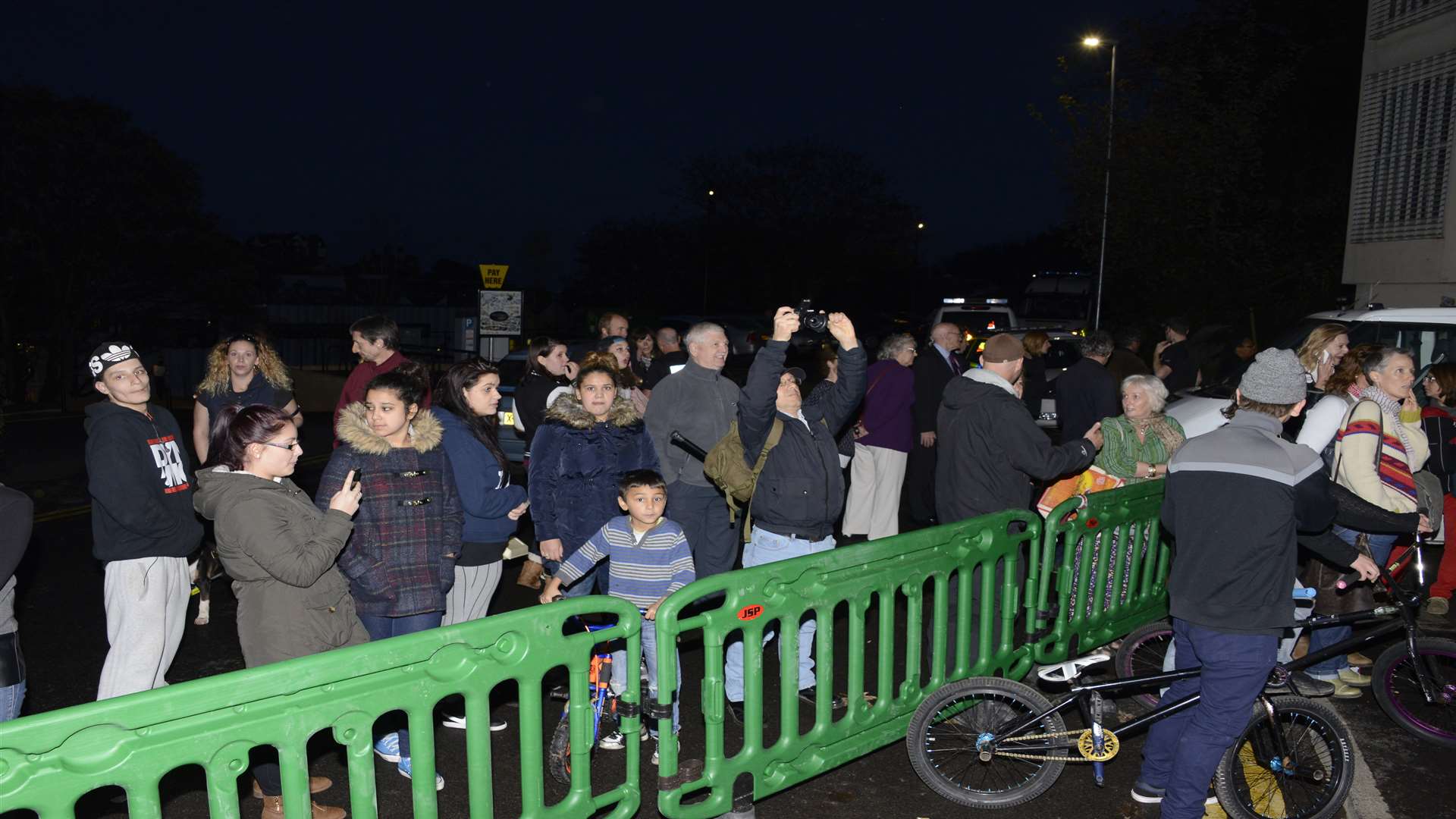 Crowds gather around the Banksy site