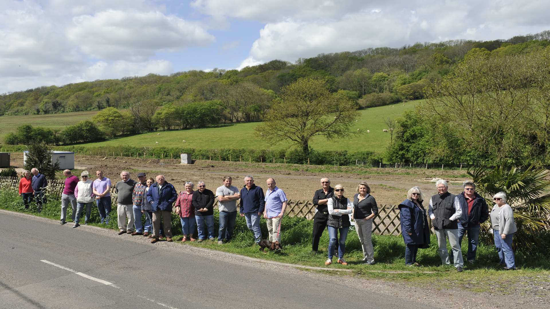 Protesters gather at the proposed site