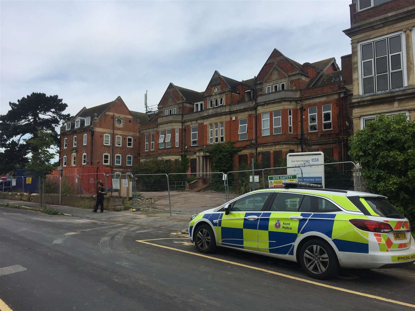 Police remain at the site as Kent Fire and Rescue teams prepare to investigate the fire's cause (15147348)