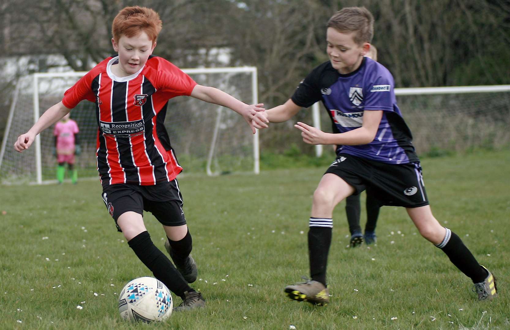 Strood United under-11s and Anchorians Panthers under-11s get stuck in Picture: Phil Lee FM31638761