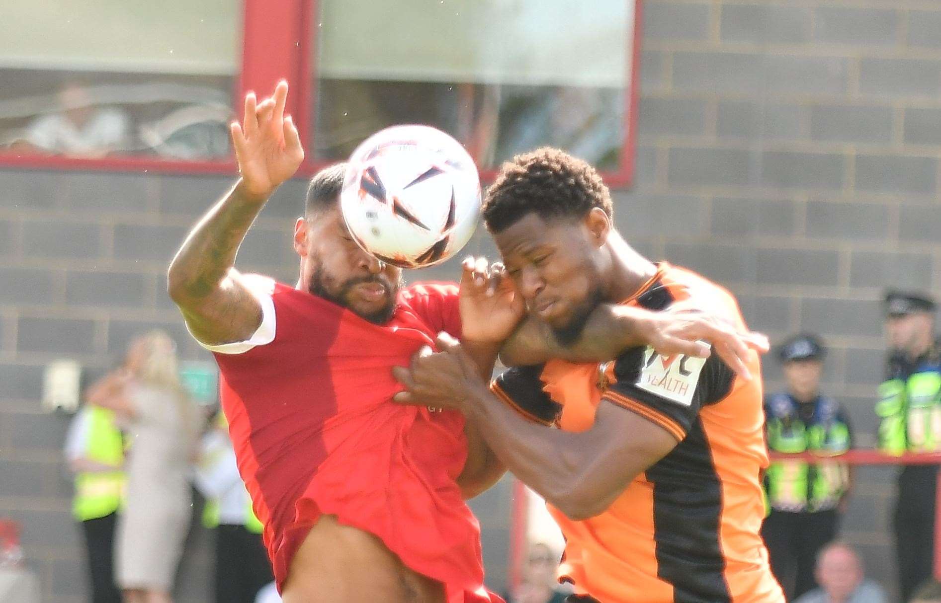 Ebbsfleet challenge for the ball in the air against Barnet defender Ade Uluwo. Picture: Ed Miller / EUFC