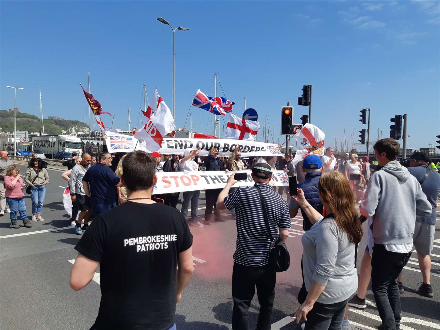 Dozens have gathered for the march in opposition to the housing of attempted refugees