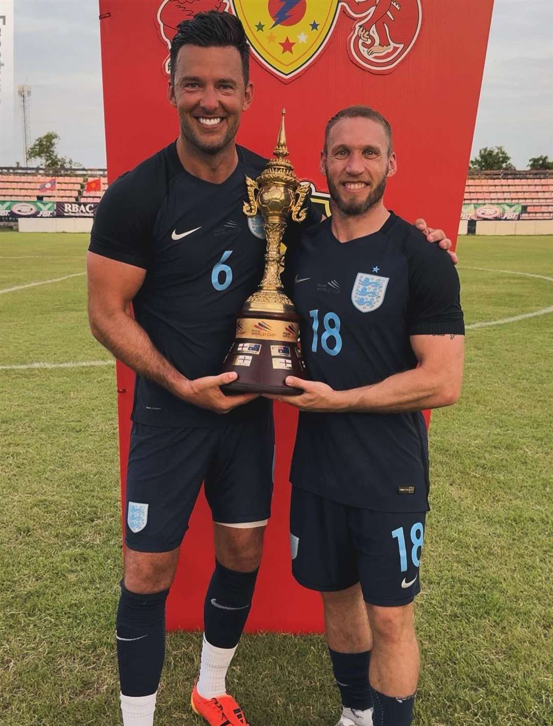 Whitstable boss Jamie Coyle and Matt Bodkin with the Seniors World Cup after their final win in Thailand