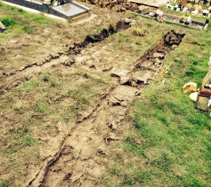 The grave was left churned up and covered with tyre marks