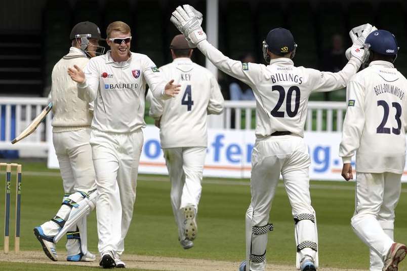 Kent off-spinner Adam Riley celebrates with wicketkeeper Sam Billings last season. The pair have both been named in provisional England Lions squads to tour South Africa next year. Picture: Barry Goodwin