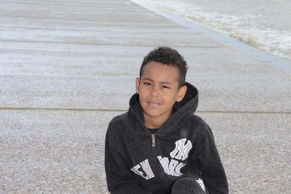 Mason Brooks on Dymchurch seafront with the ashes casket he found.