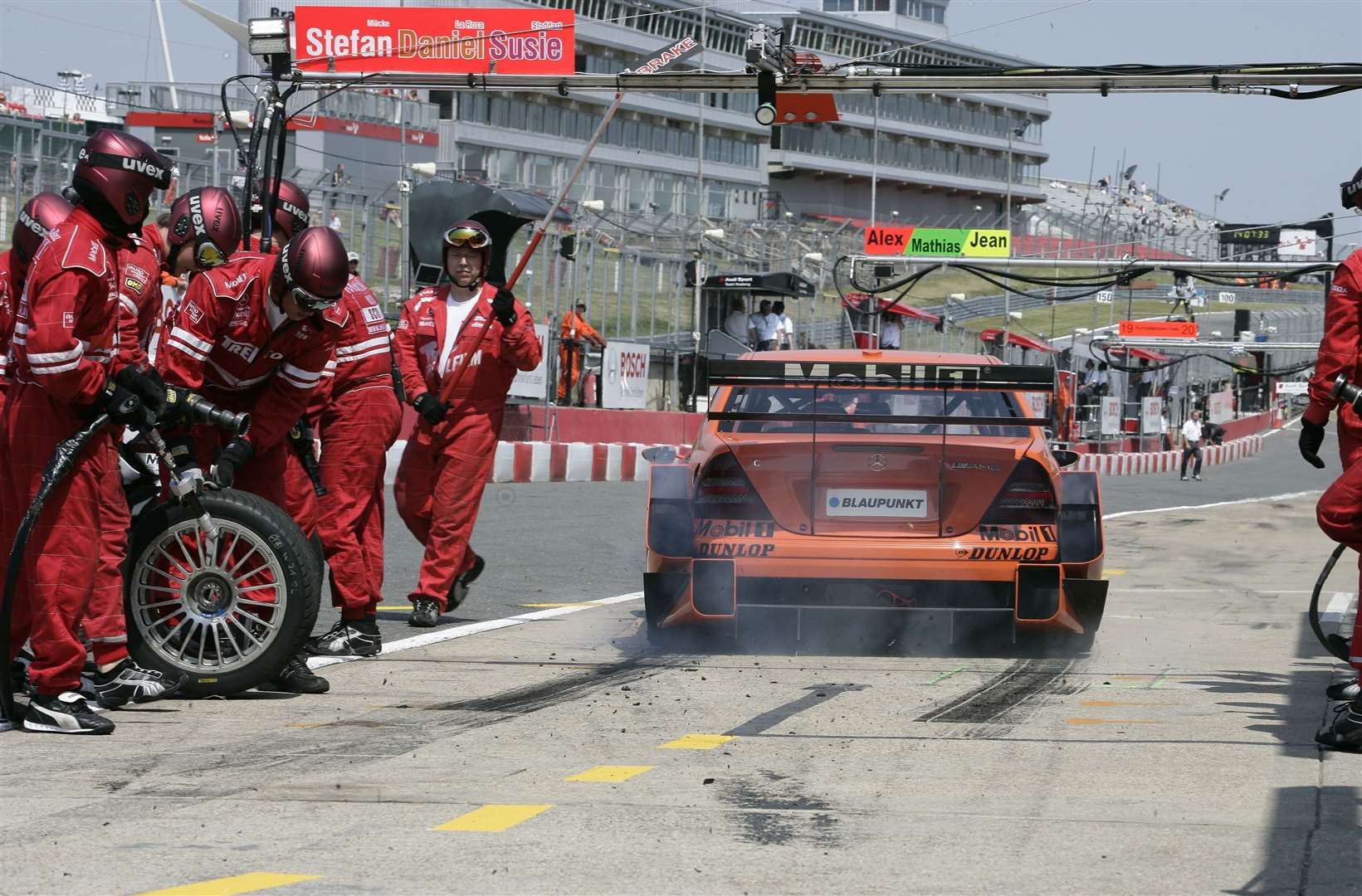 Daniel la Rosa leaves a line of tyre rubber as he exits the pits during the first DTM event at Brands Hatch in July 2006