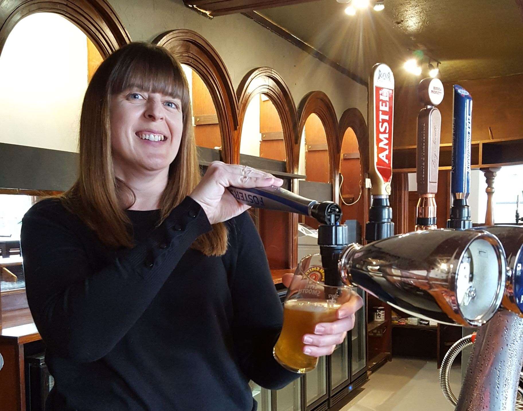 Mel behind the bar at The Plough