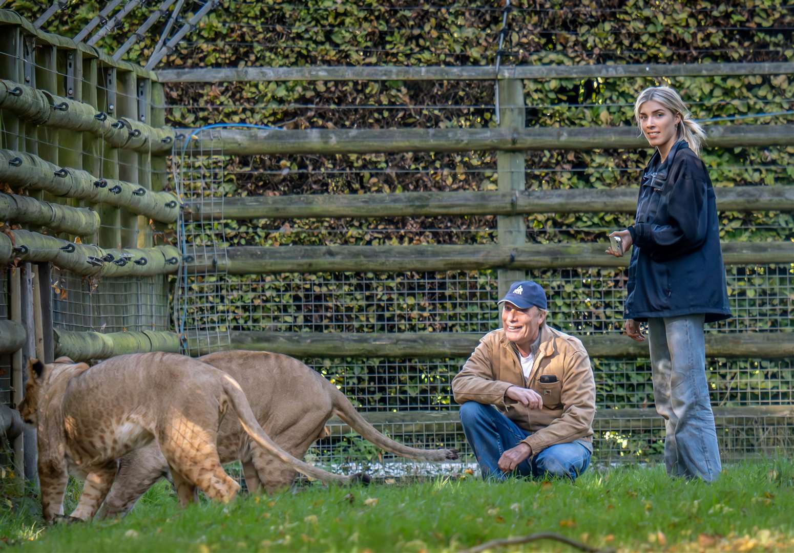 Damian Aspinall with his daughter Freya with lions Zemo and Zala at Howletts, near Canterbury. Picture: Daz TakesPhotos