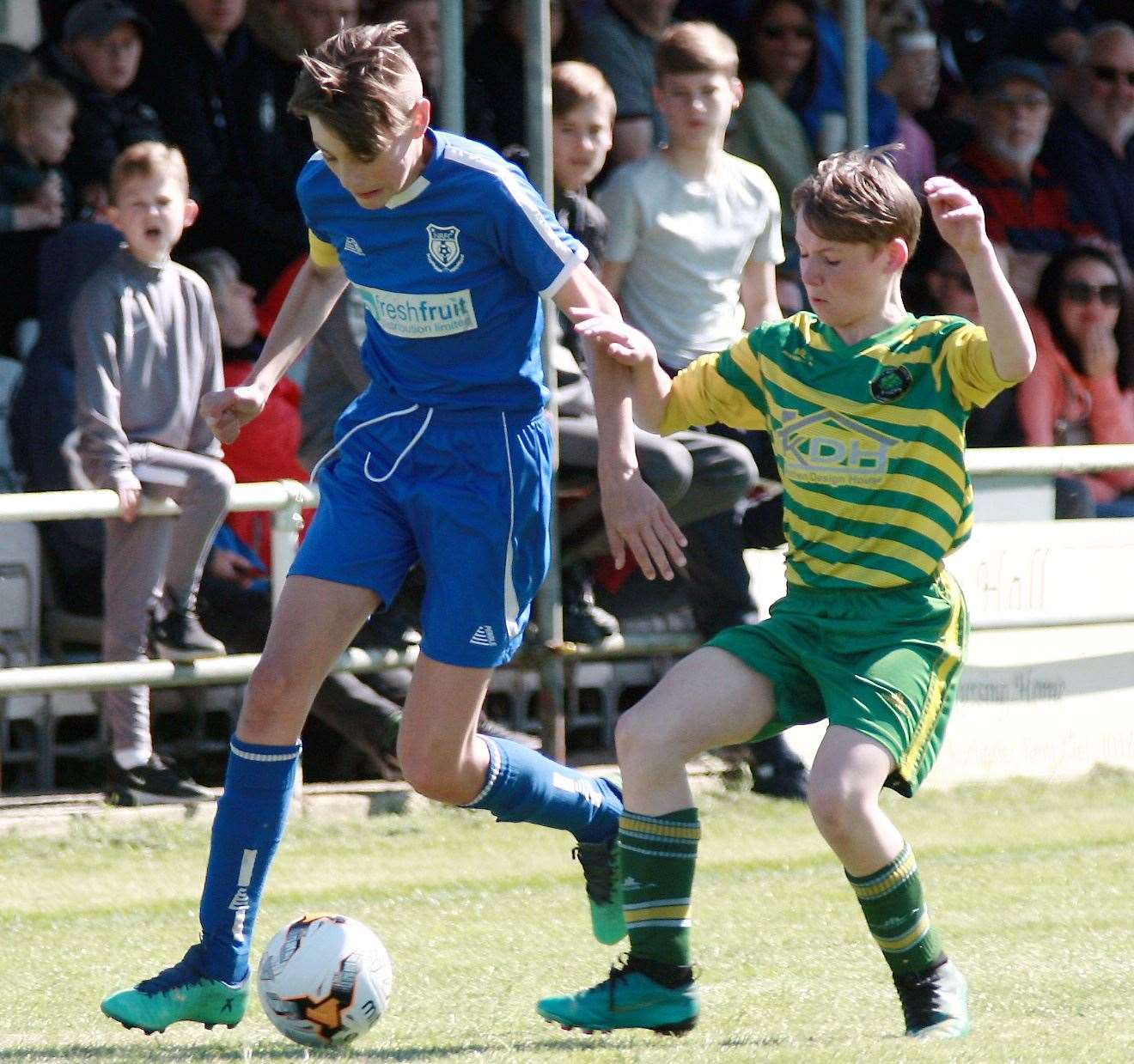 Action from the Under-14 John Leeds Trophy final as New Road (blue) hold off Cliffe Woods Colts. Picture: Phil Lee FM10148766