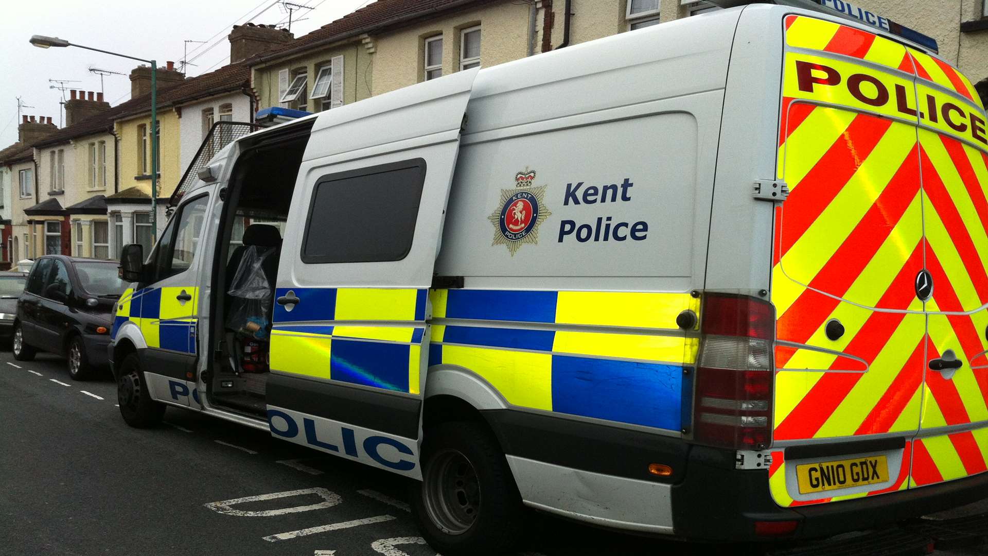 Police outside a street during morning raids