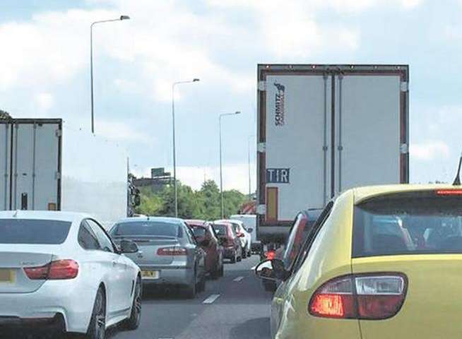 Traffic is queuing for eight miles due to an accident involving a lorry and a car on the M25. Stock image