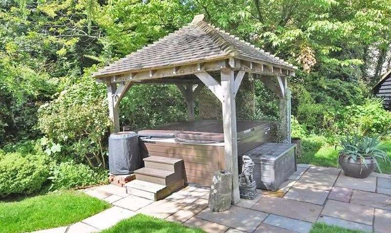 There's a hot tub hidden under the gazebo in the garden. Picture: Ferris & Co