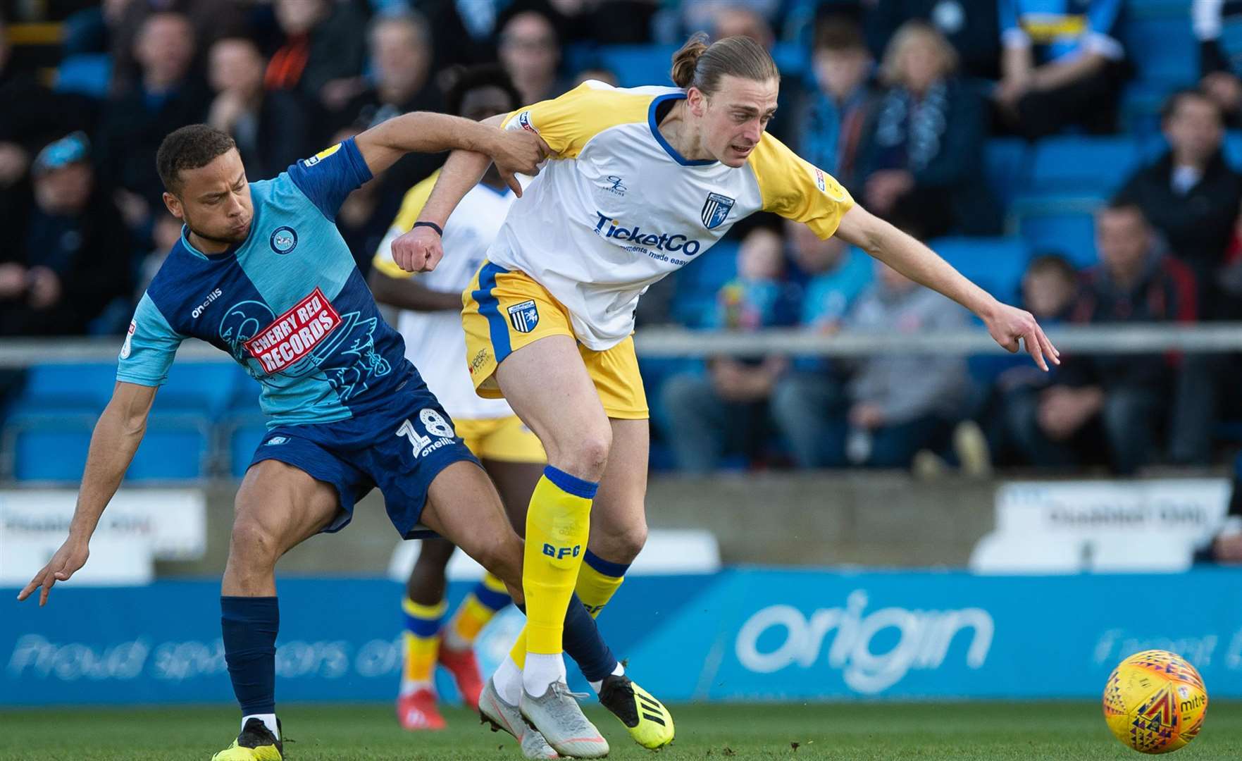 Gills striker Tom Eaves and Wycombe's Curtis Thompson tussle for the ball Picture: Ady Kerry