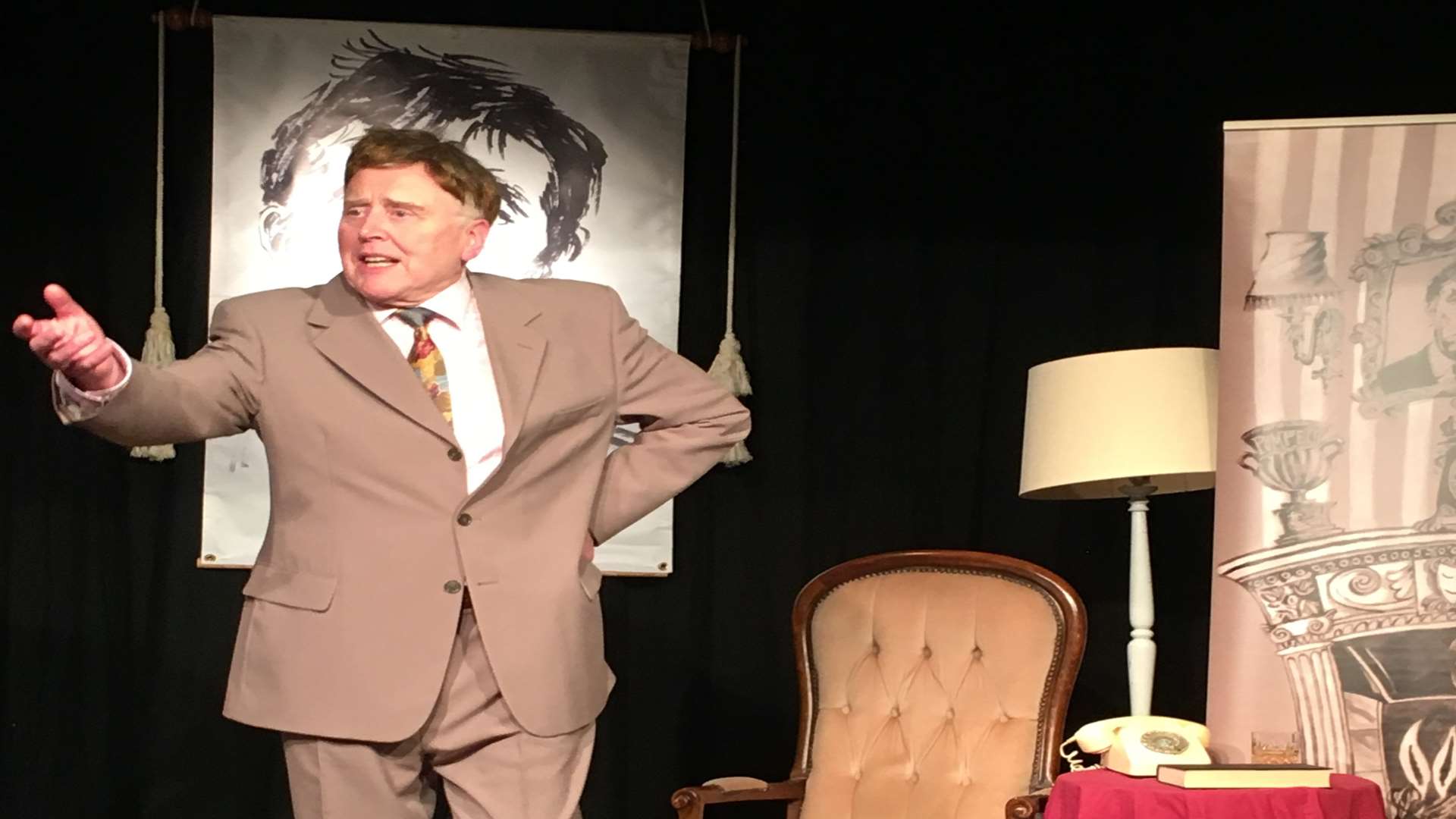 Paul Harris on stage as Frankie Howerd in his one-man play Titter Ye Not