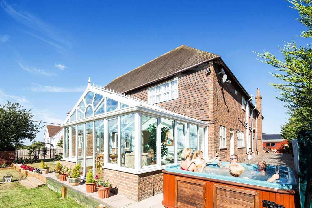 Guests can relax in an outdoor hot tub