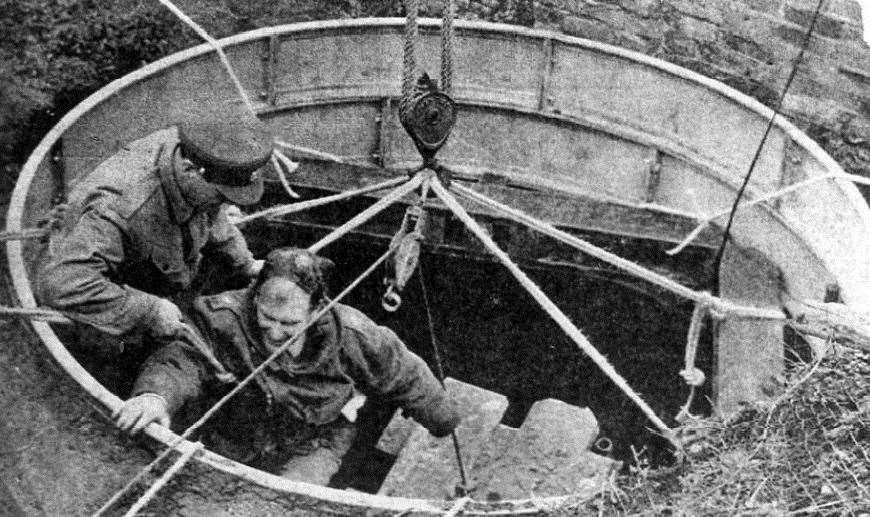 Royal Engineers make a trip down the shaft - the entrance to which had to be supported after it initially collapsed during the rescue effort. Picture: Kent Underground Research Group's Chalk Mining and Associated Industries of Frindsbury