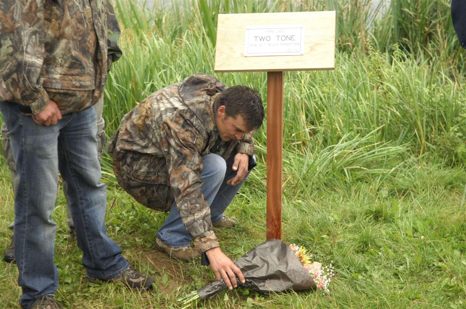 Mark Smith, who was lucky enough to catch the legendary carp, laid flowers at the memorial service