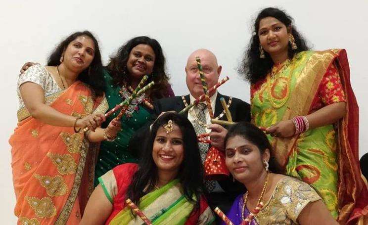 Deputy Mayor Roger Perfitt dancing with sticks to the Dandiya tunes with KTC executive team members