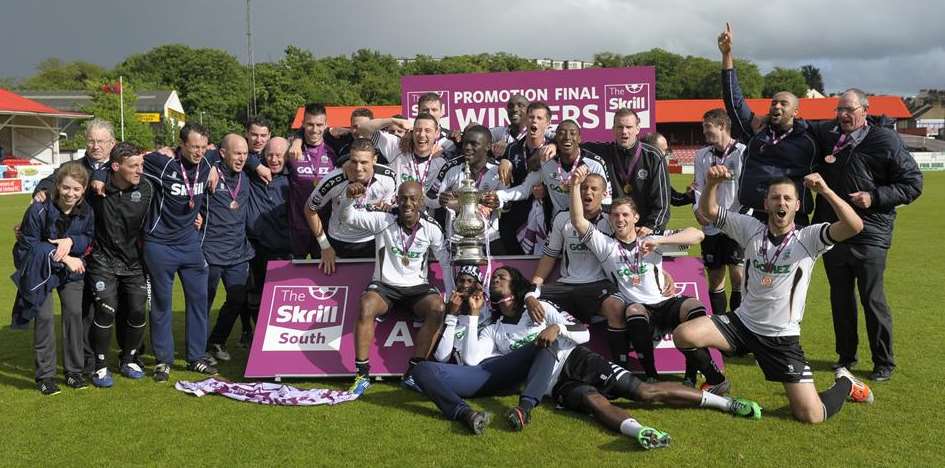 Dover celebrate in the rain after winning the play-off final. Picture: Andy Payton