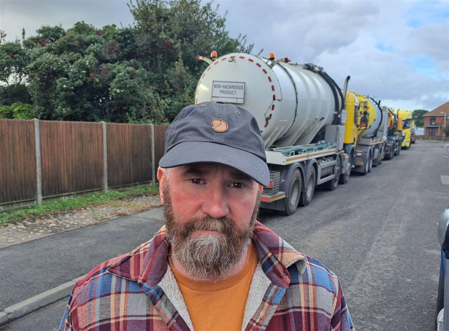 Paul Hadaway with a long queue of parked tankers and lorries in Golf Road