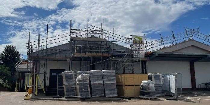 Roofing materials are stacked up in the car park