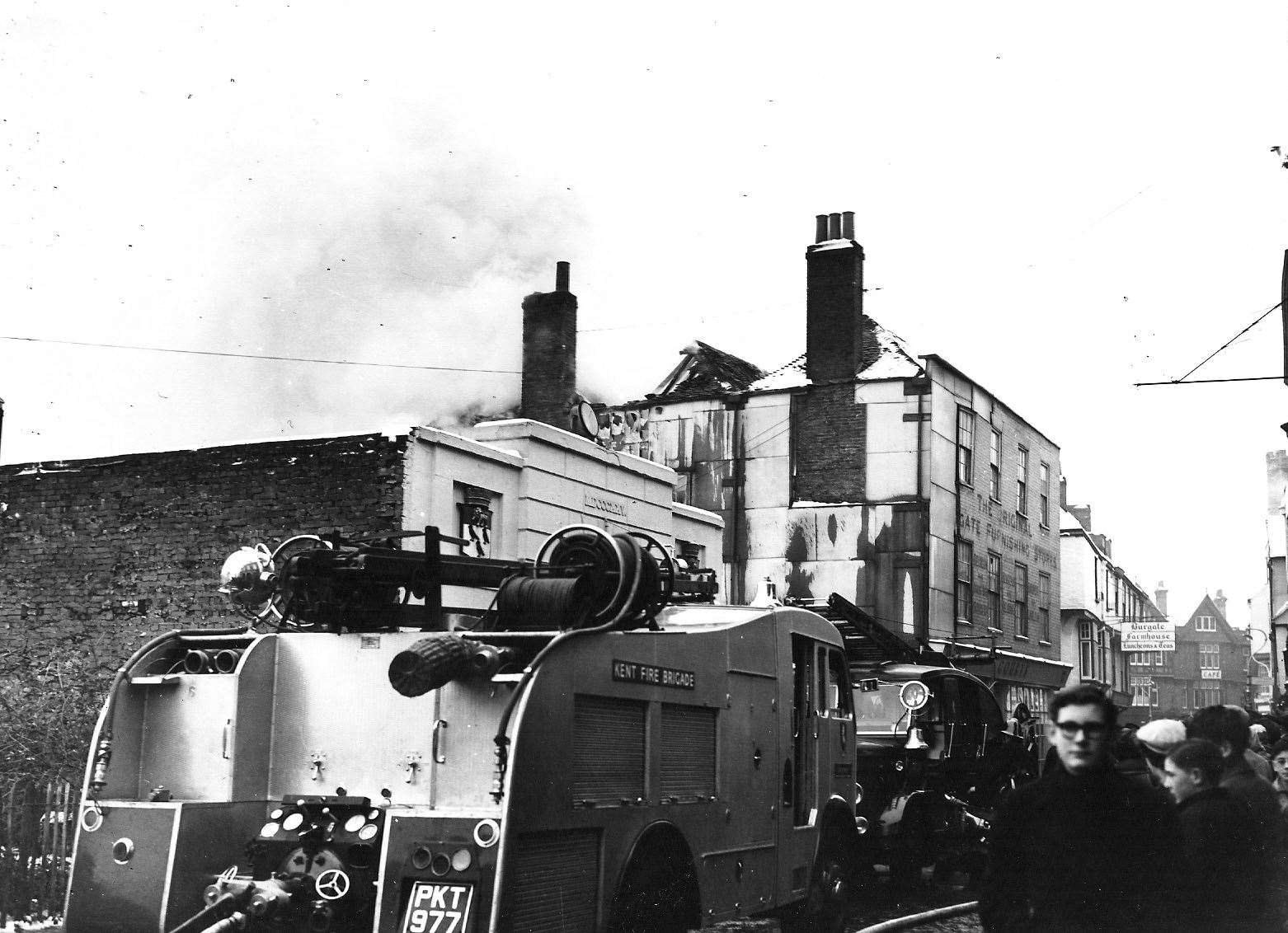 Fire tears through the upper storeys of Court Bros furniture store on the corner of Butchery Lane in January 1955. Copyright: Paul Crampton