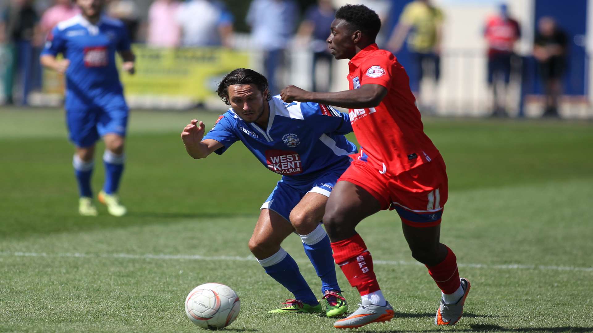 Tonbridge's Nick Wheeler (blue)