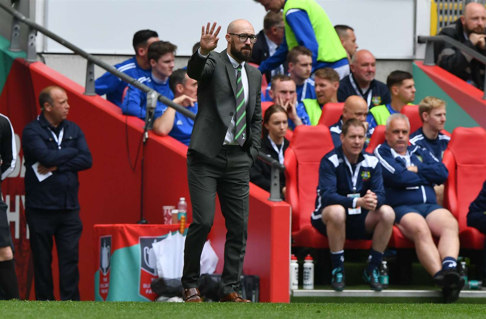 Kevin Watson tries to get his messages out onto the Wembley pitch Picture: Keith Gillard