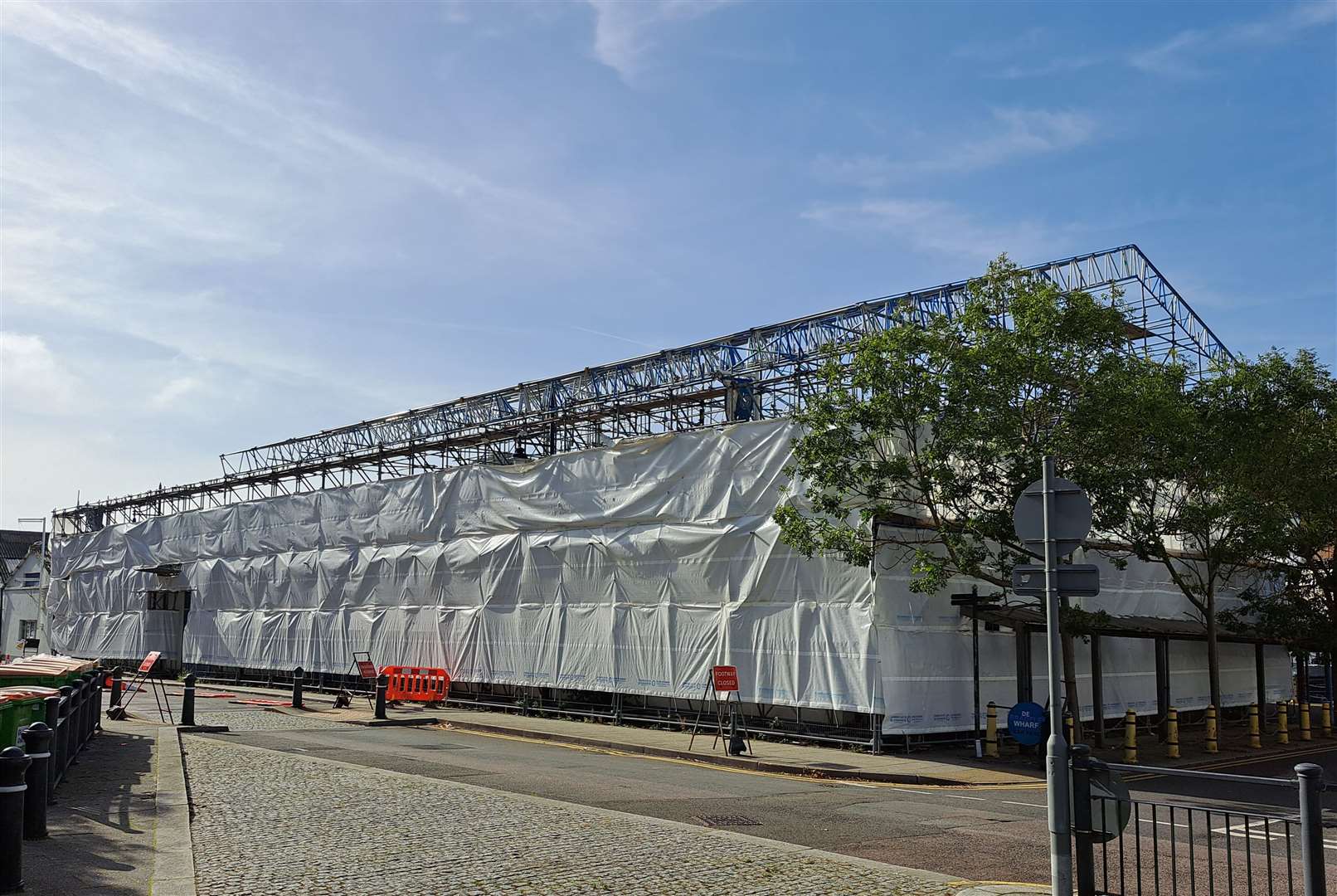 Tarpaulin now covers De Bradelei Wharf, as seen from its Cambridge Road entrance, Dover