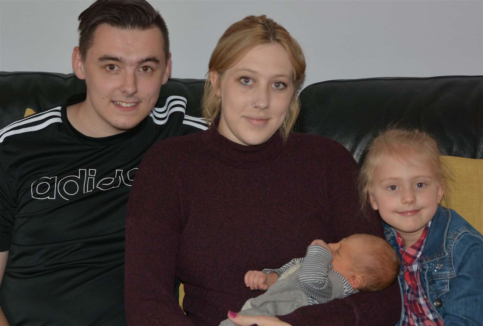 Proud parents Jordan Bampton and Melanie Burghart with children Riley and Imogen, four