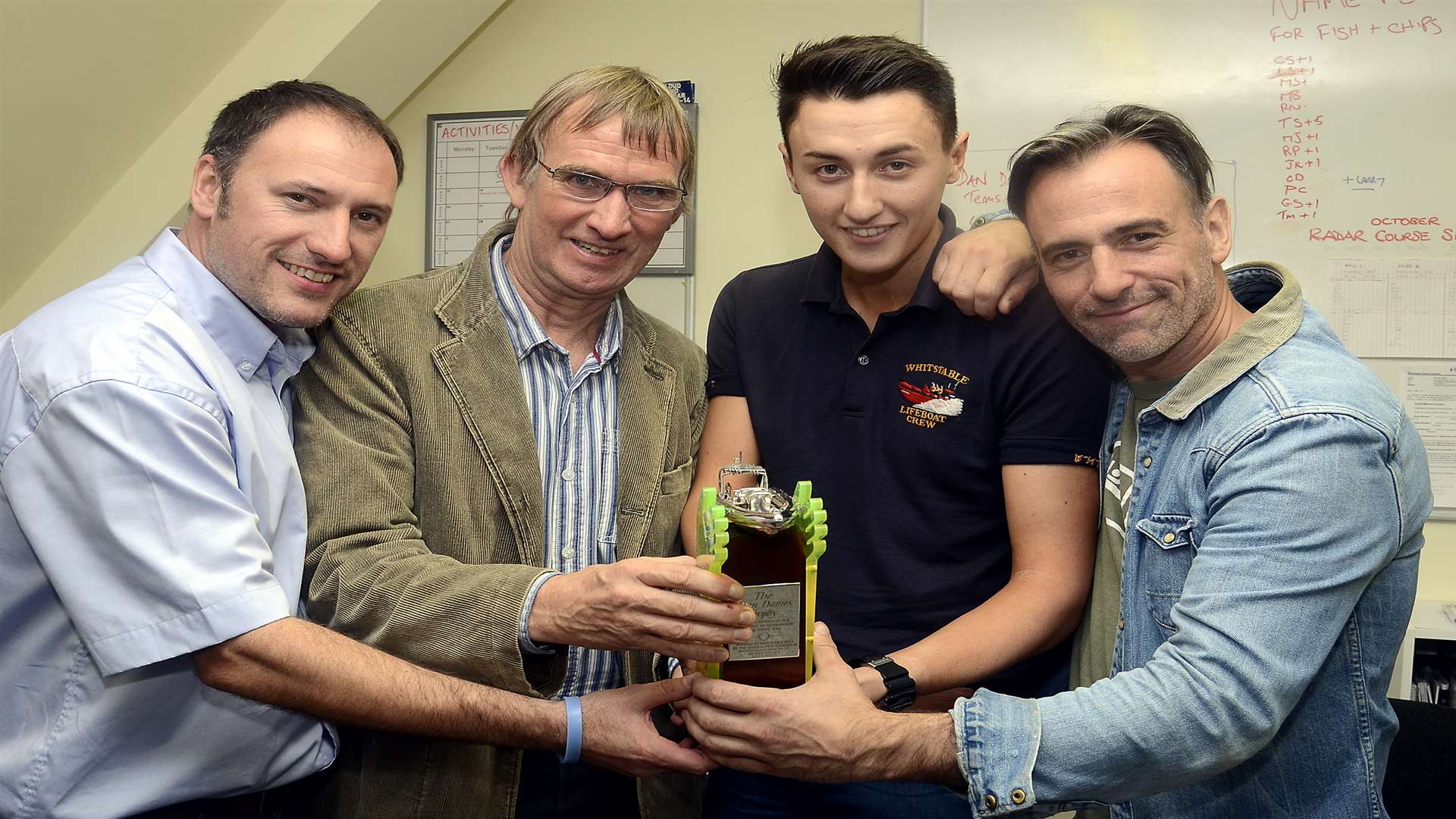 Dr Dan Davies' son Charlie presented the trophy to Craig Sidders, Liam Sidders and Matt Bate