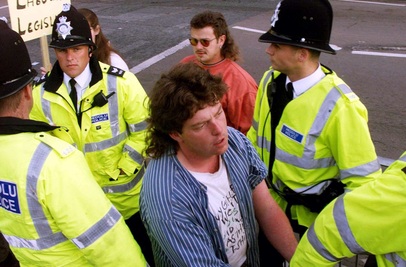 Craig Evans being led away by police in 2001 (David Kendall/PA)