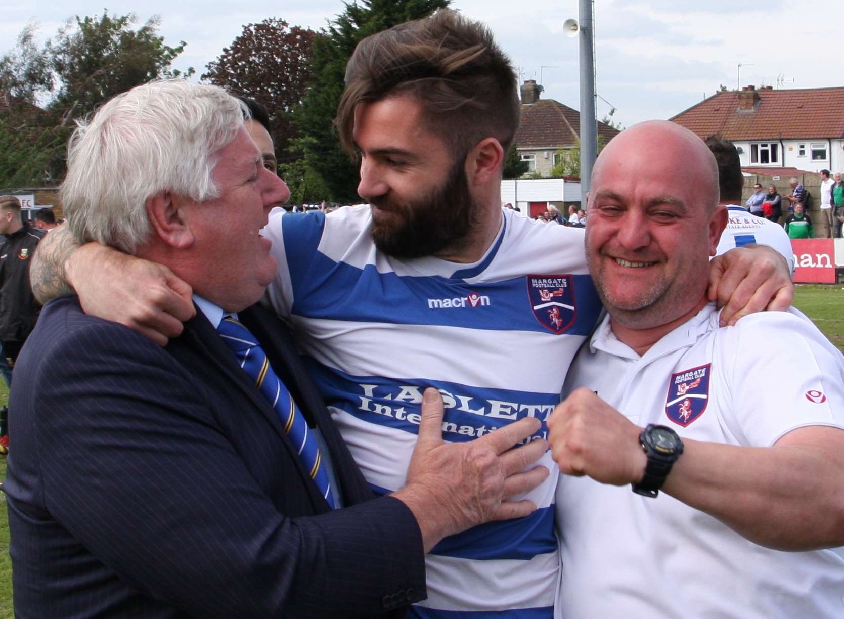 Margate chairman Bob Laslett, goalscorer Ryan Moss and goalkeeping coach Simon Pridmore celebrate clinching promotion. Picture: Don Walker