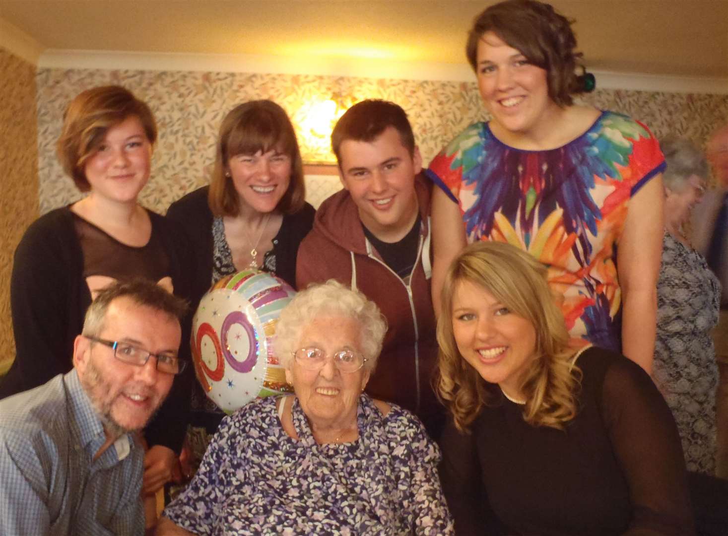 Kate and John Bosley with their children at a family party, L-R: John, Sarah, Kate, John's mother, Josh, Hannah and Charlotte