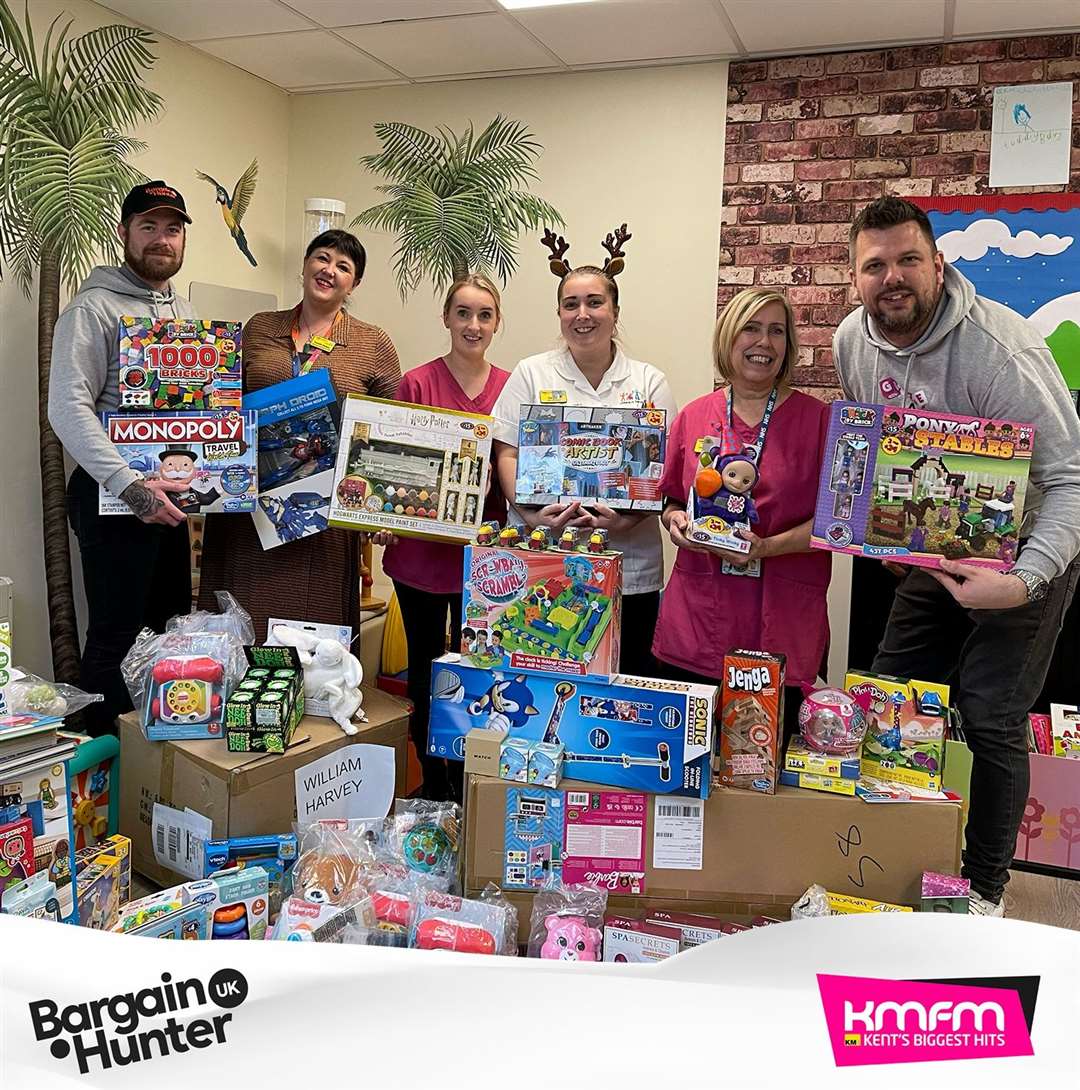 A William Harvey Hospital team receiving gifts with Rob Wills