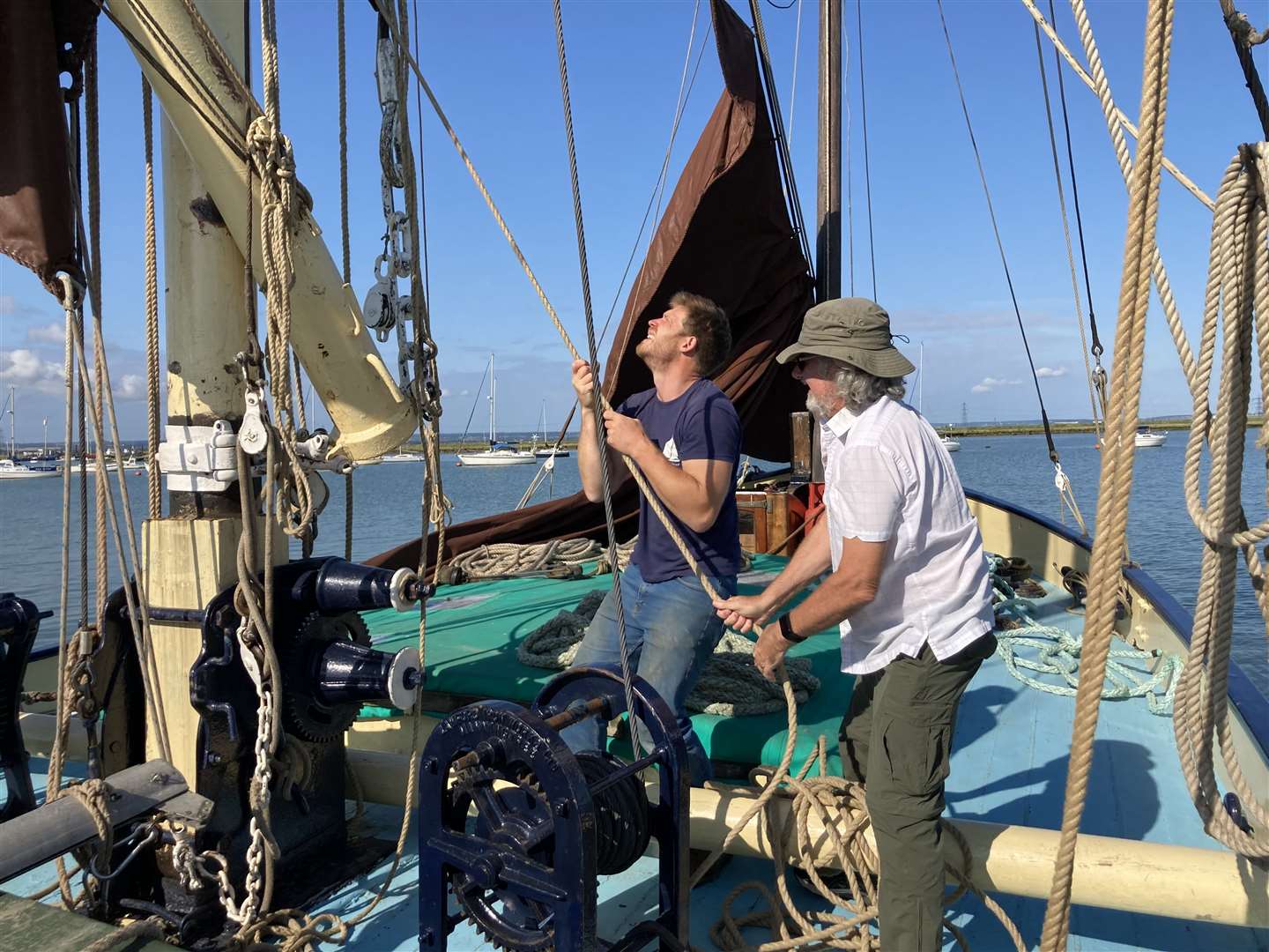 Bob Morris gets some instruction from Ed Gransden aboard the Thames sailing barge the Edith May often moored at Queenborough