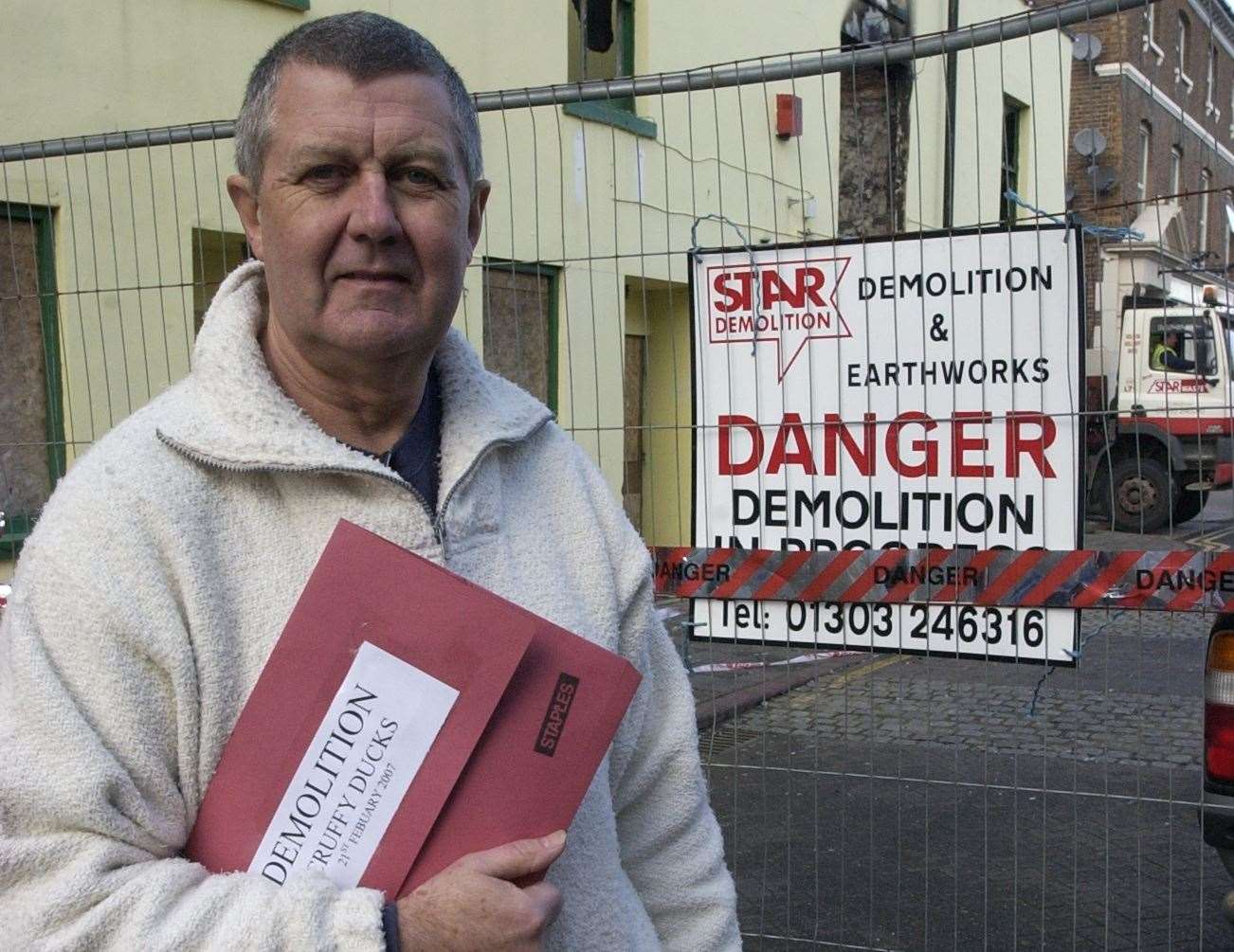 Mike Thompson, owner of Scruffy Ducks in Herne Bay, standing outside the boozer with the demolition notice in 2007