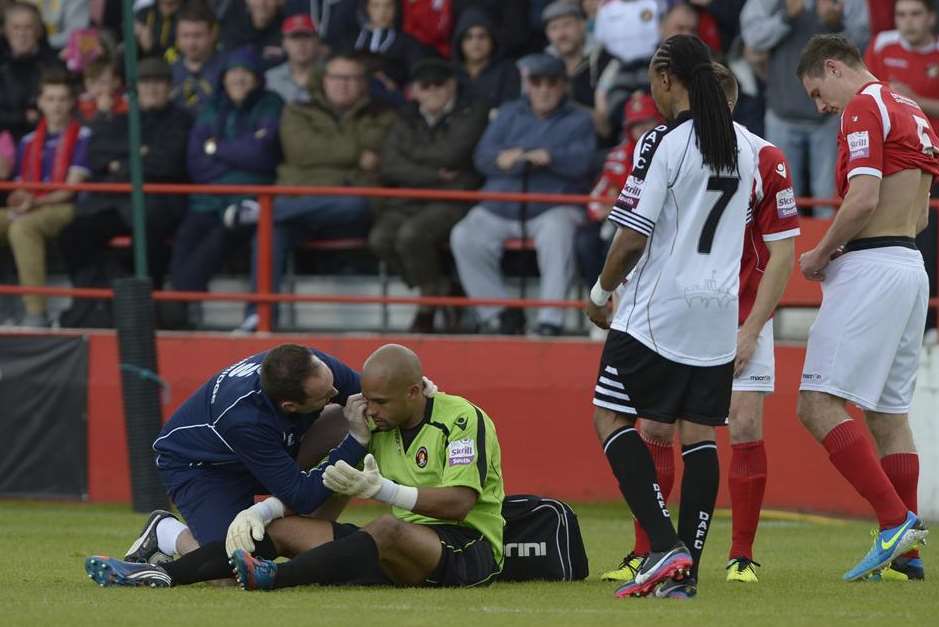 Preston Edwards receives treatment for a head injury during the play-off final against Dover Picture: Andy Payton