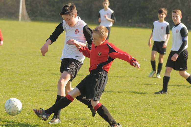 Rainham 84 under-14s (red) on the stretch against Meopham Colts in the John Leeds quarter-final Picture: Steve Crispe