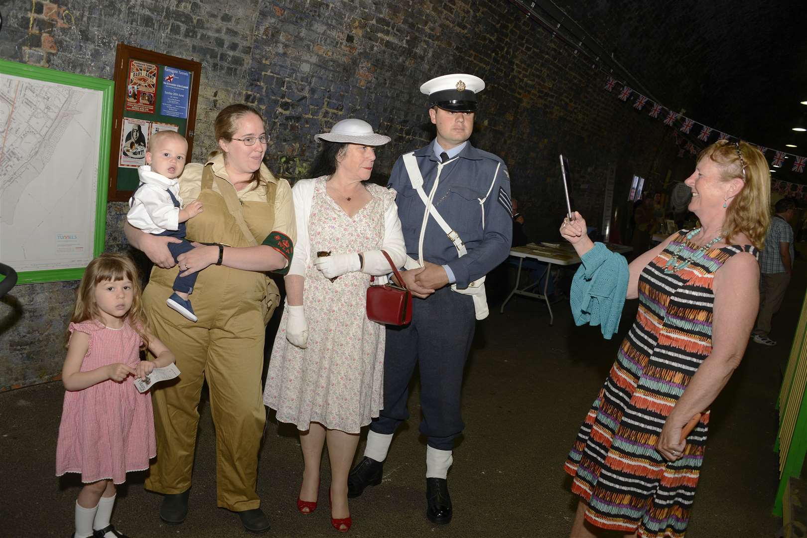 A visitor photographs the dress of the war years (11607409)