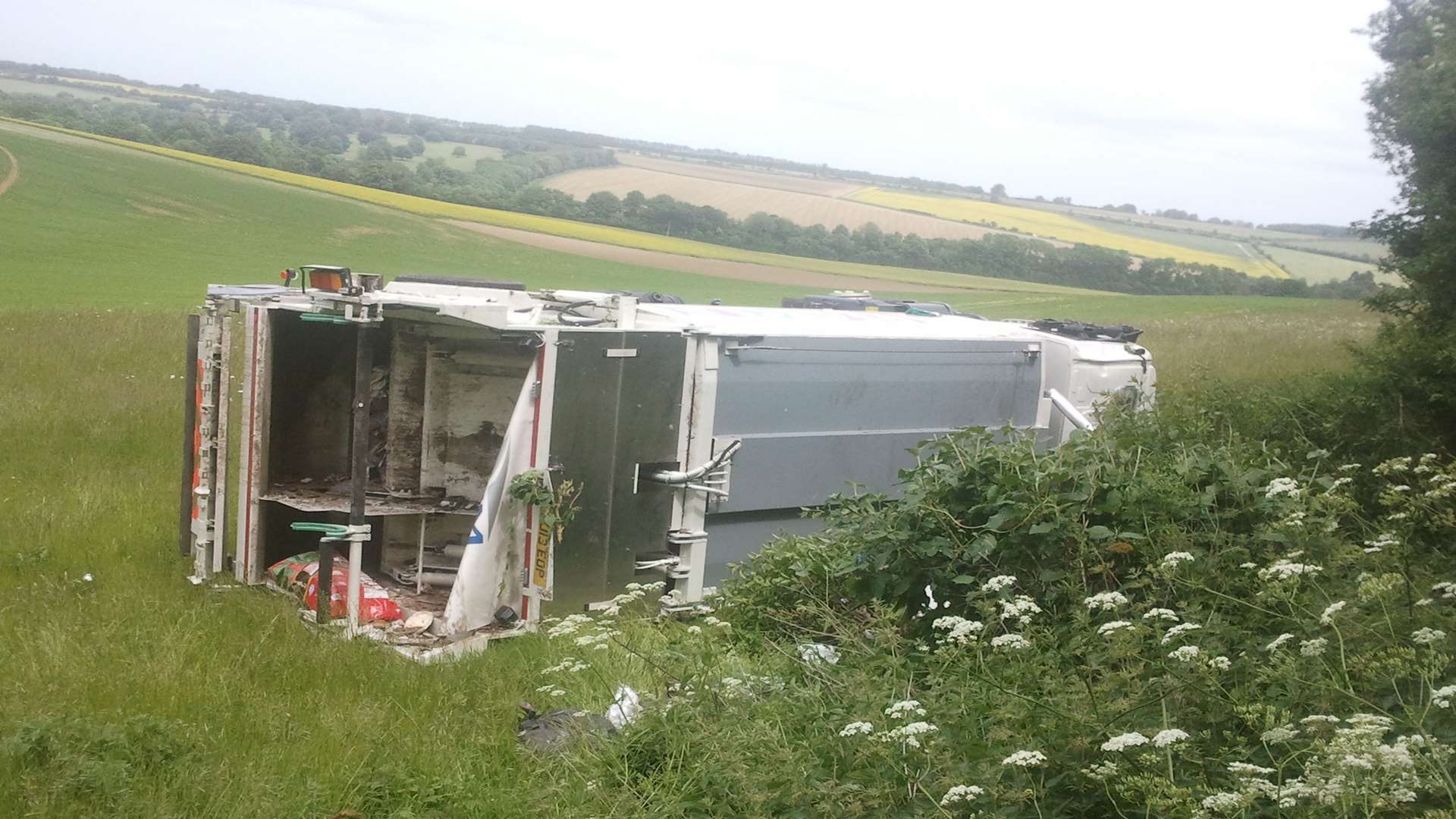 The Serco truck on its side in a field