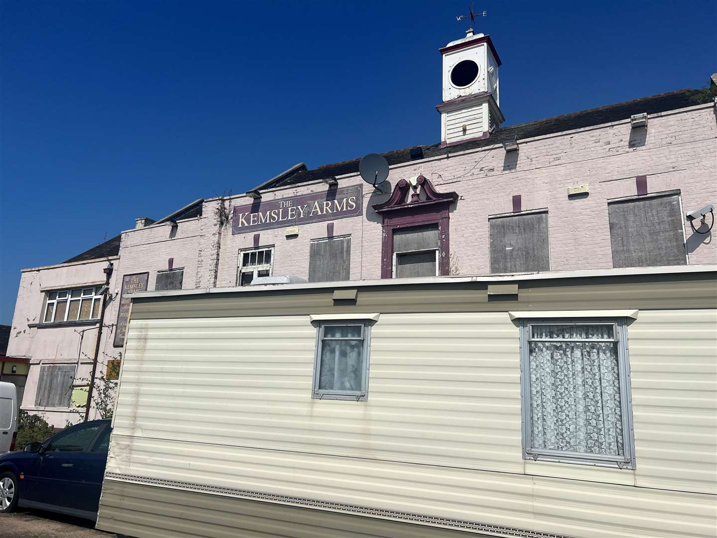 The Kemsley Arms and the vandalised caravan in Ridham Avenue, Kemsley. Picture: Megan Carr