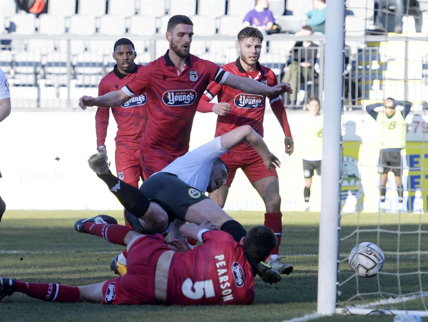 Dover's Jake Goodman bundles the ball home in their 3-1 home defeat to Grimsby. Picture: Barry Goodwin