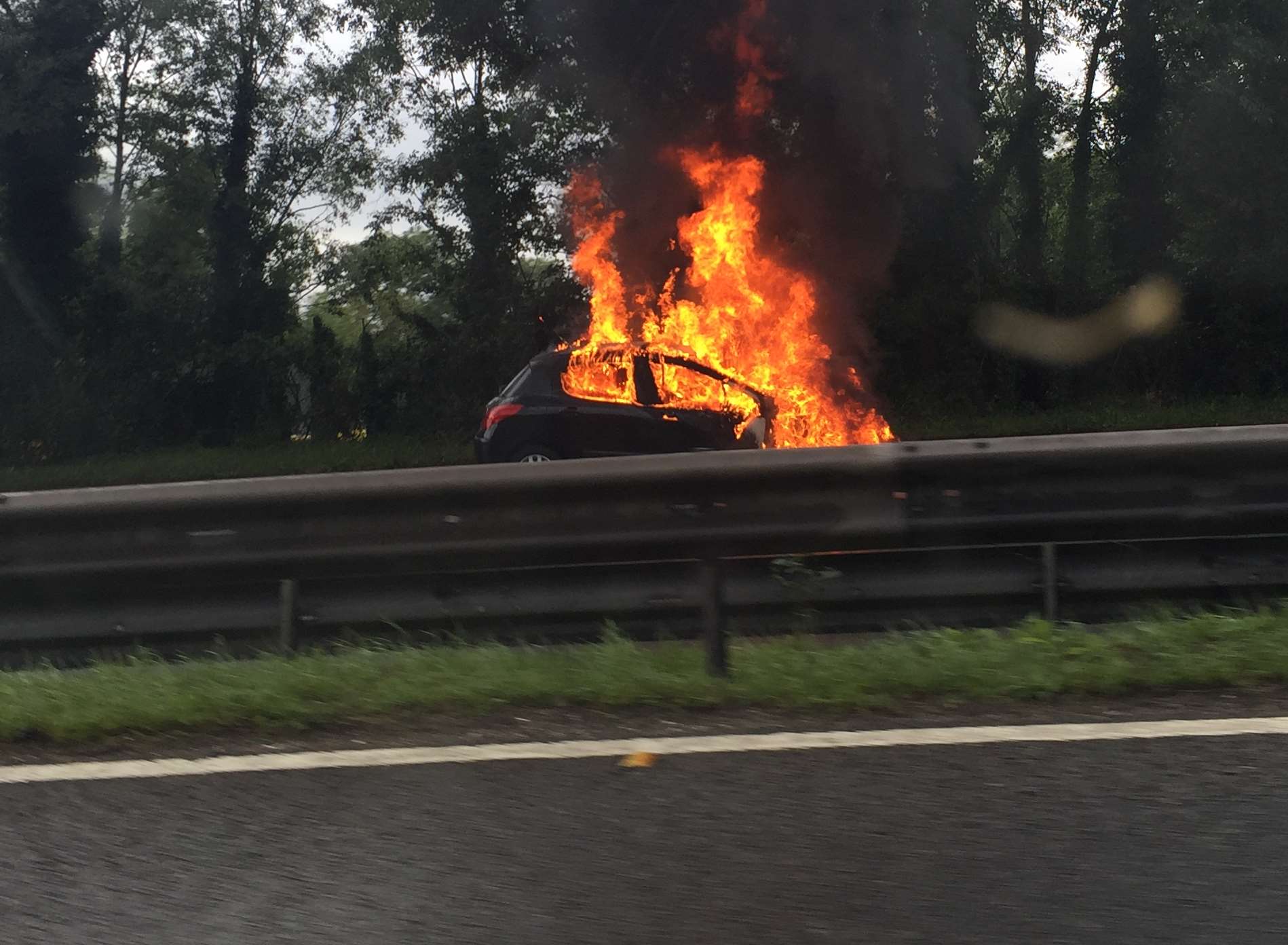 The car was well alight near Blue Bell Hill