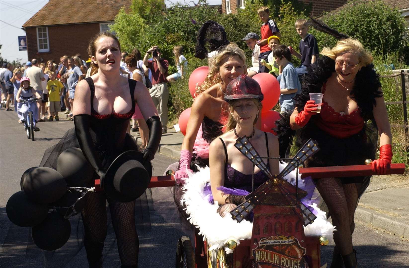 Charity wheelie bin race at the Three Horseshoes pub in Hernhill, Faversham, in July 2003. The pub, run by Shpherd Neame, is still serving pints today. Picture: Derek Stingemore