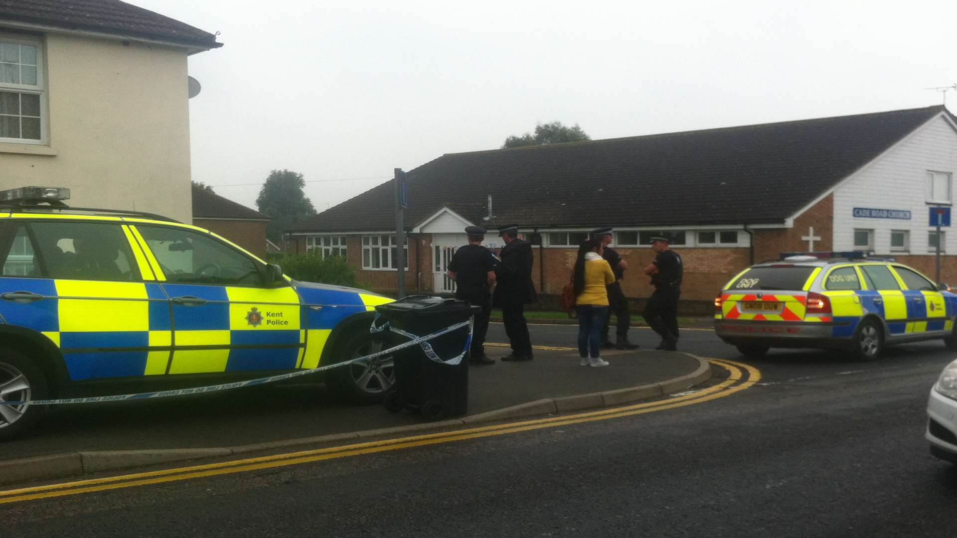 Residents gather as armed police descend on Cade Road in South Ashford