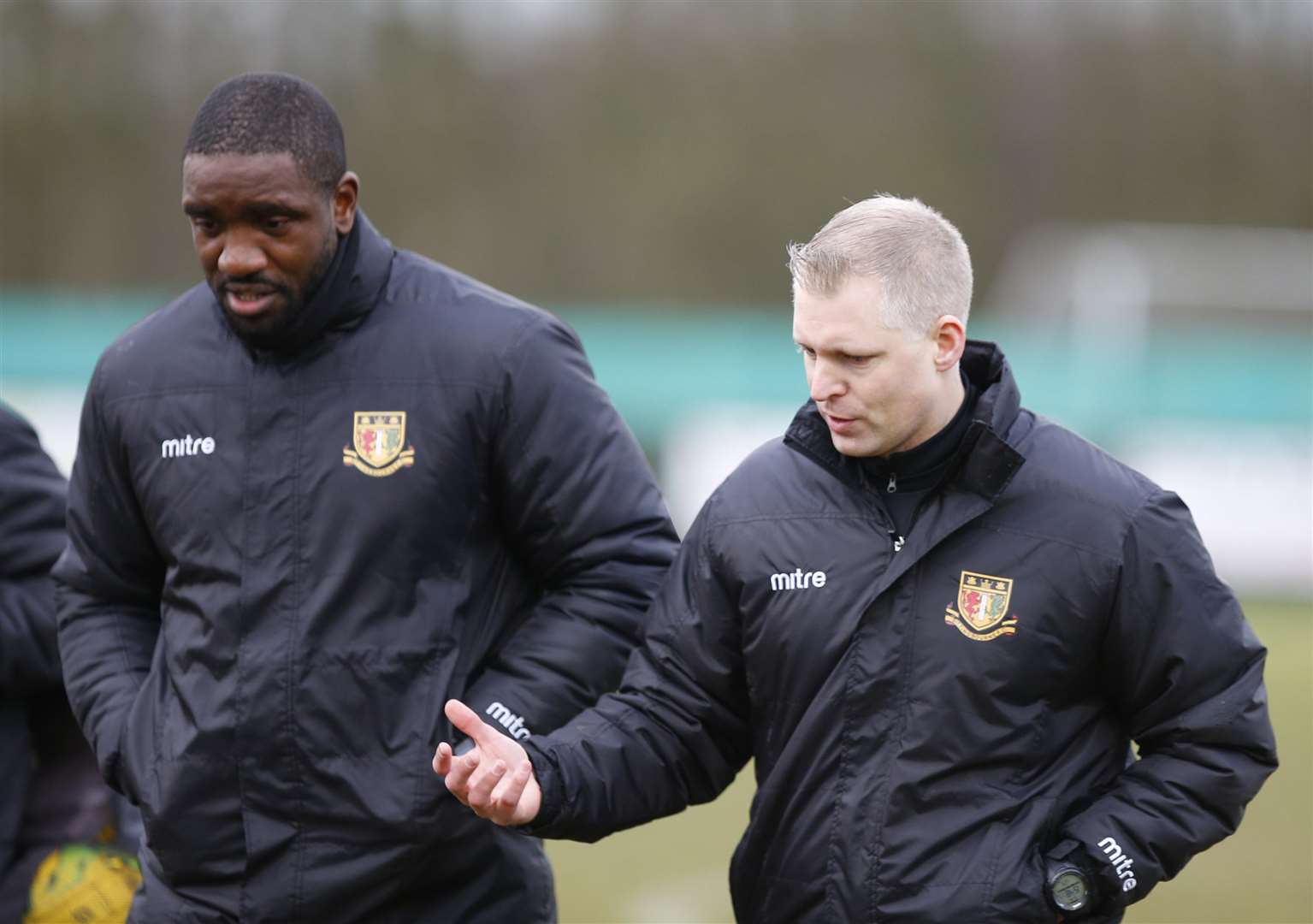 Sittingbourne boss Chris Lynch talks tactics with player-coach Nathan Elder Picture: Andy Jones